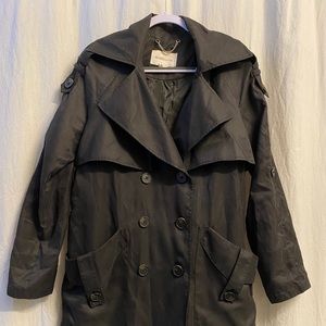 Black button up trench coat.